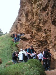 Some of the class checking out this large outcrop of weathered, volcanic rock.