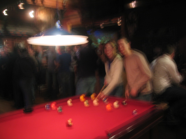 Shakily playing pool in Christchurch... interestingly, this was not to be the last pool game of the night.