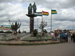 Taking a break next to a statue of "three bad presidents", according to Rubin
