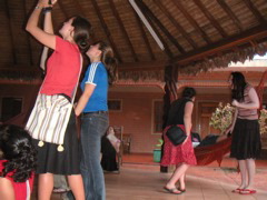 People check out the bats and lizards hanging out on the gazebo roof; Charlotte is speechless