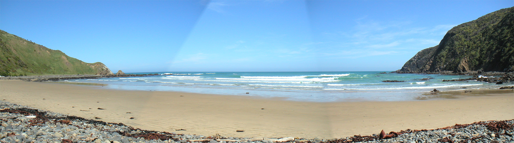 I ate lunch at this beach just down the hill from Nugget Point, called Roaring Bay.  Supposedly penguins come ashore here at dusk.  There wasn't much happening at midday, but it was sure a beautiful place.