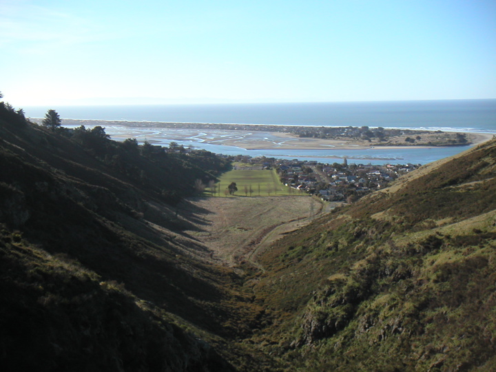 Awesome.. looking back at the valley we hiked up through.  That is a spit outside of Christchurch; beyond, the ocean.