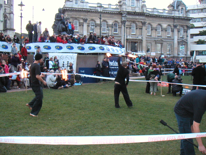 There were also people twirling fire batons and torches of various shapes and sizes.  And a drum band playing (not visible in this picture).  Quite exciting. I think the fire twirlers have a Uni club.