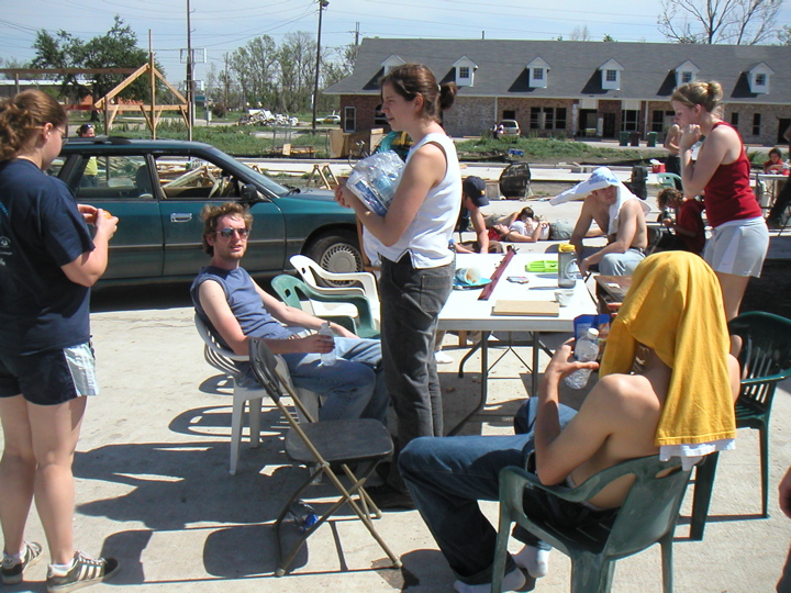 So what all did we DO to help out?  Common Ground's goal was mainly to get houses rebuilt so that residents could come back and occupy the neighborhoods, which would also allow them to vote in the next election.  The government has essentially done nothing to help in this area other than supply a few FEMA trailers.  So thousands of student volunteers came down to do some of the work.  One thing we needed was water bottles and snacks (which Katie is holding).