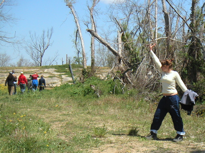 Sarah strikes a crazy pose with the levy in the distance