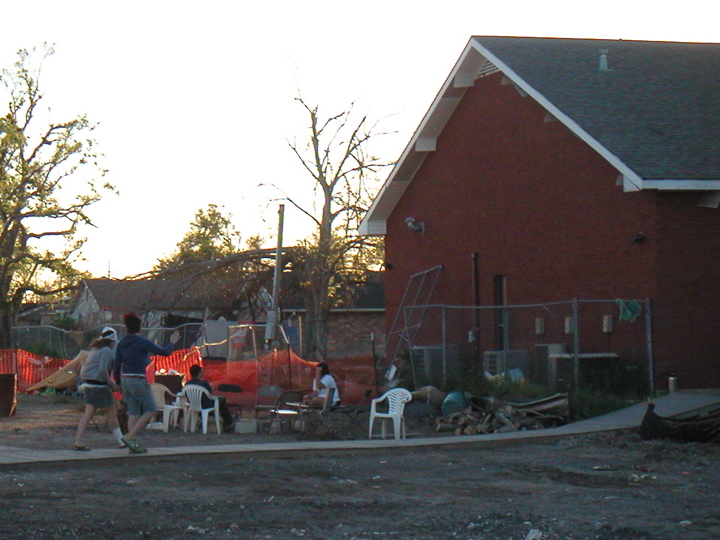 The chairs here are around the campfire.  The building on the right is a community center which the volunteers were working on rebuilding.