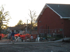 The chairs here are around the campfire.  The building on the right is a community center which the volunteers were working on rebuilding.