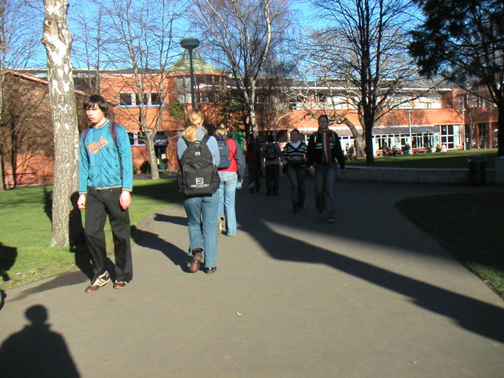 During passing times there are students EVERYWHERE.  Unfortunately this picture only managed to capture a fairly wasted-looking guy.  The building in the background is the student union building, with various places to eat and stuff.