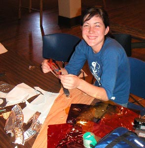 Britney beams as she cuts lighting gels.